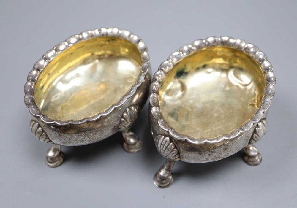 Two similar mid 18th century silver oval salts, London, 1753? and 1762, marks rubbed, length 8.5cm, 6oz.